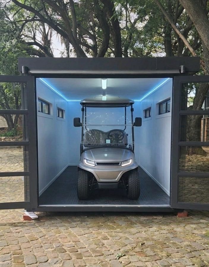 Container conversion fitted as a lit golf cart garage